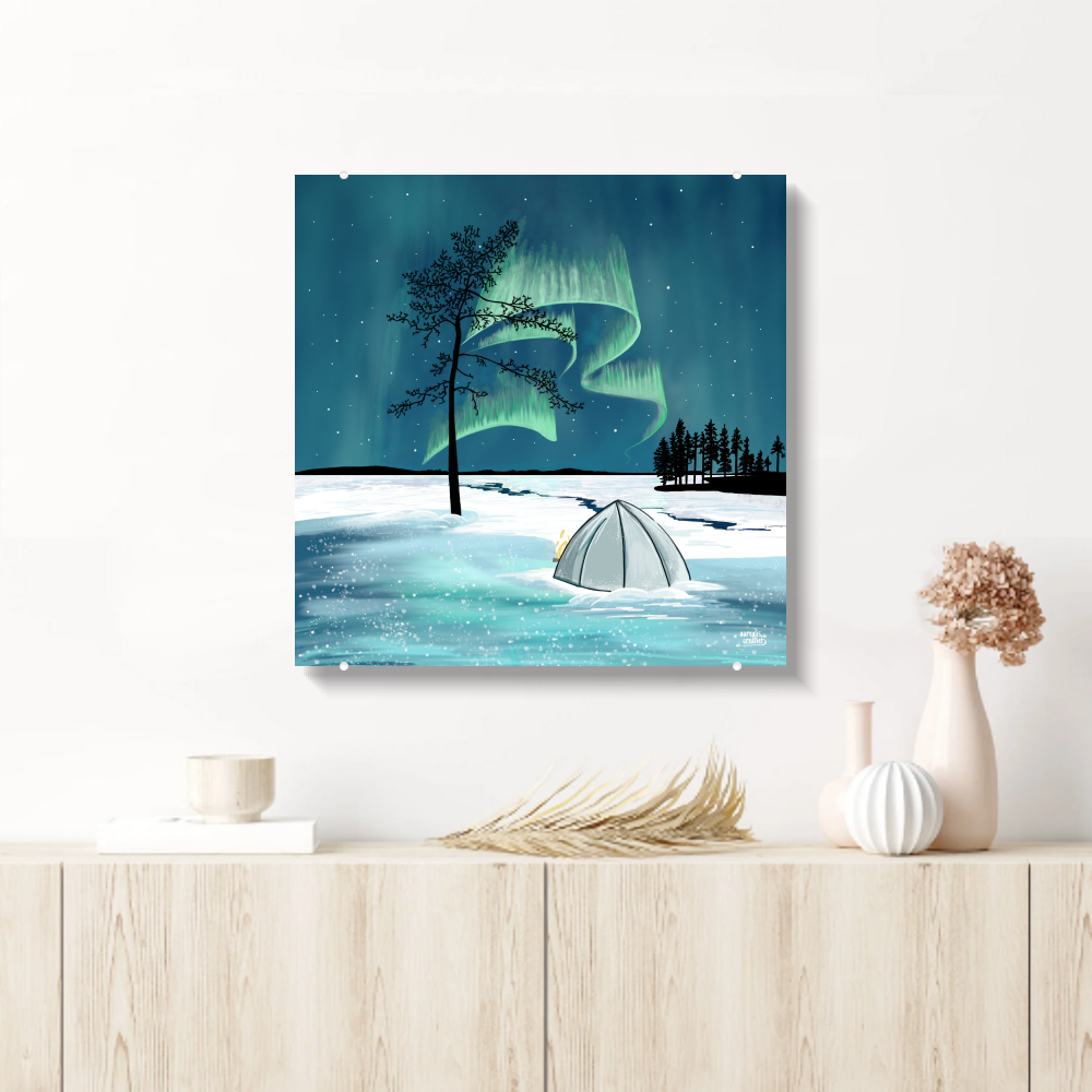 Nordic wall art — aurora and Lapland winter scene on acrylic glass, displayed in a Scandinavian interior. From the Lapland 8 Seasons collection by Els Bancken, Aurealis Creatief.