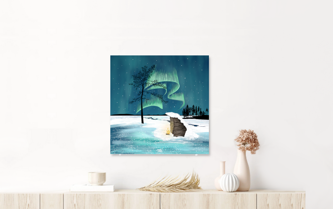 Nordic wall art — aurora and Lapland winter scene on acrylic glass, displayed in a Scandinavian interior. From the Lapland 8 Seasons collection by Els Bancken, Aurealis Creatief.
