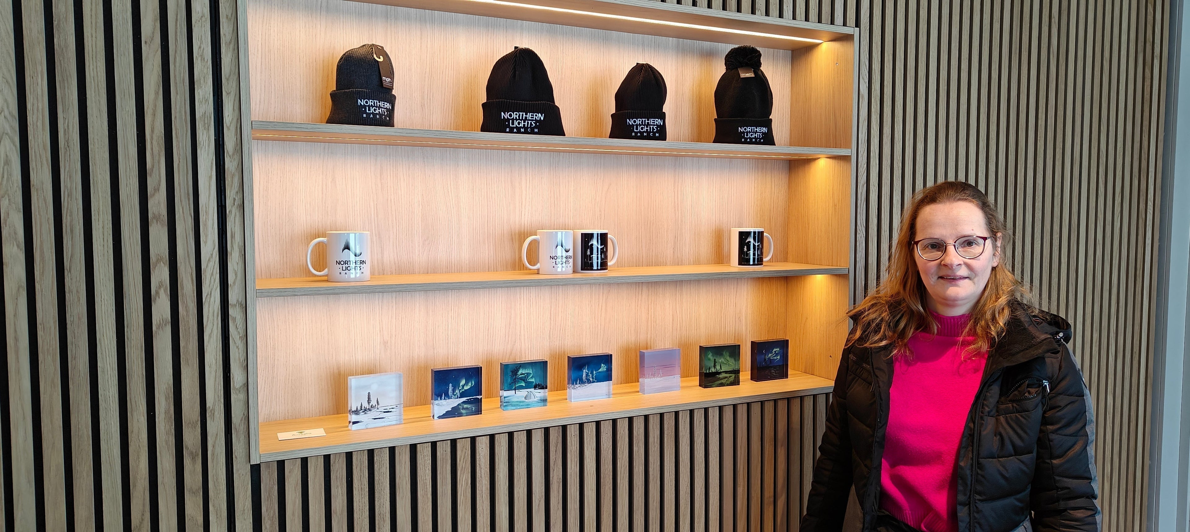 Els Bancken next to her Lapland 8 Seasons art blocks at the Northern Lights Ranch souvenir shop in Levi, Finnish Lapland